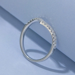 Macro shot of V-shaped sterling silver ring with pavé setting and sparkling stones