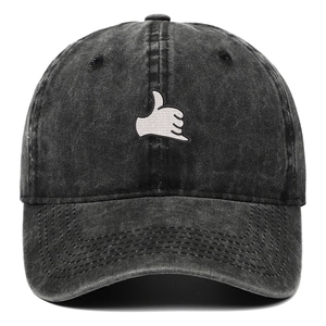 Close-up of vintage washed denim baseball cap with white Shaka gesture embroidery detail