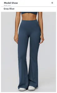 Detail of high-waist flared yoga pants in dusty blue showing slimming fit and fabric texture
