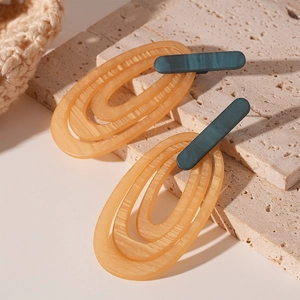 Retro resin geometric oval hoop earrings with amber texture and striped design