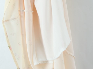 Detail of floral chiffon dress with soft lining and high quality stitching finish