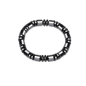Macro view of elastic hematite bead bracelet with polished cylindrical and disc stones