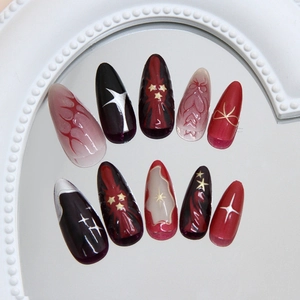 Gothic 3D red stars and black bow press-on nails in medium almond shape on mirror surface