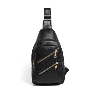 Classic black pebbled leather crossbody chest bag with golden zippers for women