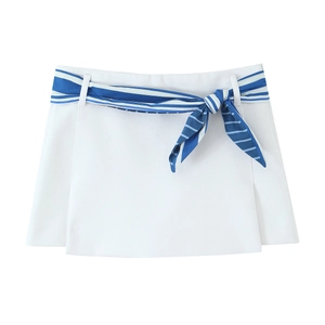 White halter top and striped skort set in flat lay presentation with waist belt