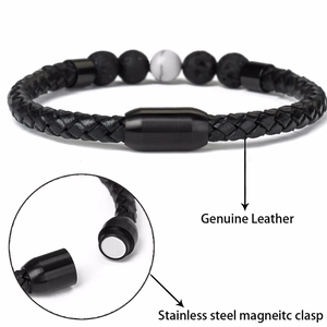 Detail view of black braided leather bracelet with lava stone and magnetic steel clasp