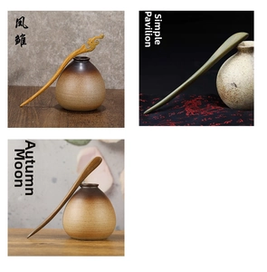 Three vintage sandalwood hairpins in yellow, green, and brown wood with carved patterns