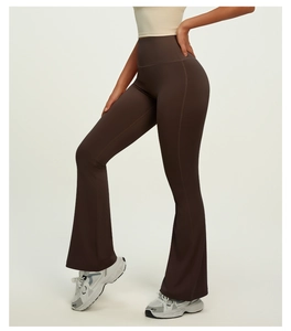 Detailed back view of high-waisted flare yoga pants in brown with body-shaping fit