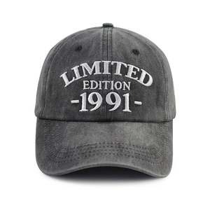 Detailed view of white 3D embroidery on a vintage washed cotton baseball cap