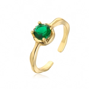 Close-up of gold-plated ring with a round faceted green zircon in a claw setting