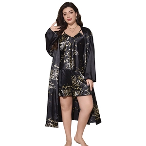 Three-piece women's floral satin pajama set with camisole, shorts, and long robe in black