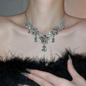 Detailed view of luxury silver flower necklace with sparkling waterdrop crystal pendants