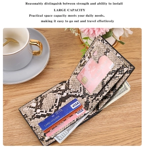 Internal view of snake pattern bifold wallet showing card slots and cash compartment