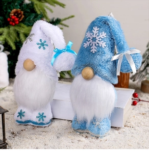 Close-up of white and light blue Christmas gnomes with snowflake patterns and soft textures