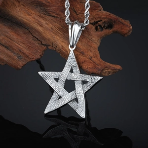Detail of silver stainless steel star pendant with hammer texture on a twist chain