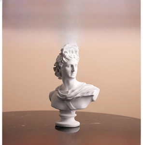 Detail of Apollo resin bust sculpture showing high-quality white matte texture and fine features