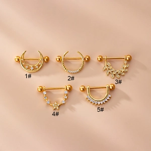 Zircon inlaid stainless steel nipple rings with moon star leaf designs on pink background