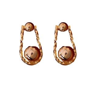Minimalist gold-plated twisted metal hoop earrings with elegant spherical charm