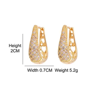 Elegant gold U-shaped hoop earrings with micro-set zircons and hollow heart details