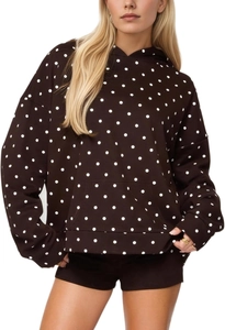 Detail shot of brown hooded sweatshirt and shorts set with white polka dot patterns