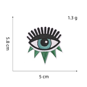 Embroidered evil eye patch in blue and white with detailed dimensions 5.8x5cm