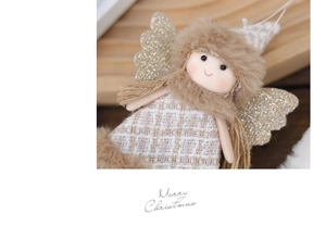 Detailed close-up of a Christmas angel doll with soft fur trim and silver sequined wings