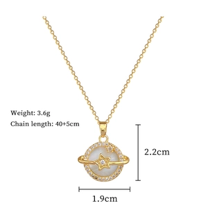 Macro detail of gold planet necklace with shell texture and 2.2cm pendant dimensions