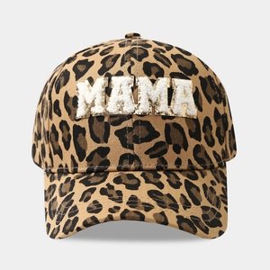 Detail of leopard print baseball cap featuring gold-edged MAMA sequin letter patches
