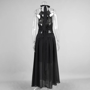 Detail of polka dot halter dress featuring an open back with elegant tie fastening