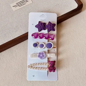 Detailed close-up of a 5-piece purple hair clip set with resin bears and faux pearls
