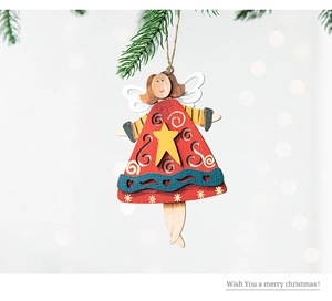 Detail showing a handcrafted wooden angel ornament with red dress on a Christmas tree