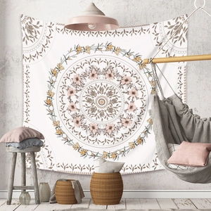 Detail of bohemian mandala tapestry on wall with chic Nordic home decor elements