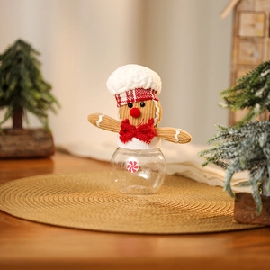 Detail of gingerbread chef candy jar with corduroy hat and clear plastic container