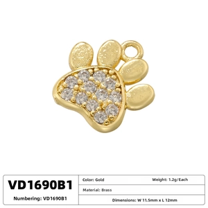 Detailed view of a gold-plated brass paw print pendant with clear zircon inlay stones