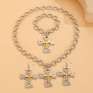 Detailed set showing silver hammer-textured cross necklace, bracelet, and earrings