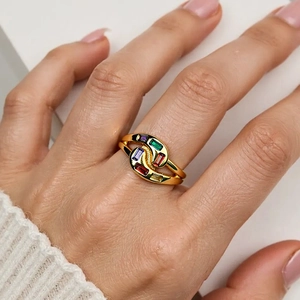 Minimalist gold wrap ring with colorful rectangle zircons shown on finger