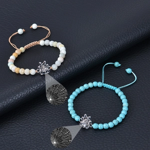 Turquoise beaded bracelet with dog paw projection stone and adjustable woven cord