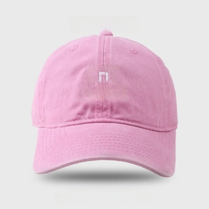 Detail of pink cotton baseball cap featuring white CAT MOM embroidery and cat whiskers