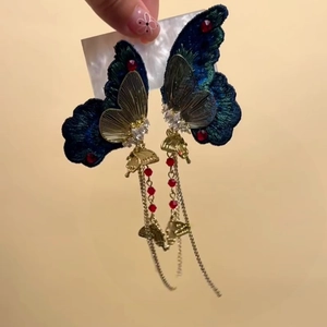 Exquisite embroidered butterfly tassel earrings with blue fabric and dangling golden chains