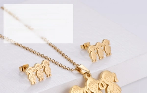 Detailed close-up of three girls silhouette gold pendant and matching stud earrings