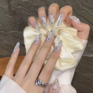 Almond cat eye press-on nails with 3D white floral patterns and pearls decoration