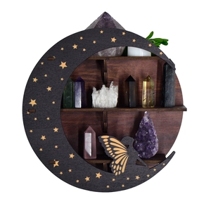 Detailed view of dark brown moon-shaped wooden shelf with star and fairy cutouts