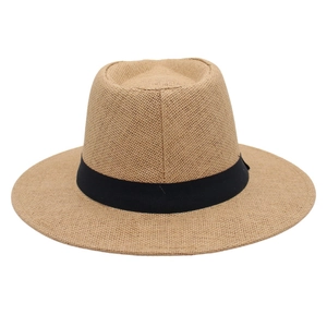 Detailed view of the woven texture and black ribbon band on a straw fedora sun hat