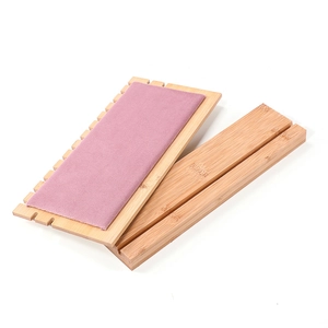 Pink wooden necklace display stand with plush lining and side slots for jewelry storage