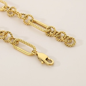 Stylish gold-tone stainless steel curb chain bracelet with mixed twist link design