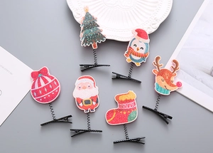 Details von 6 glitzernden Weihnachts-Haarclips mit Weihnachtsmann- und Rentier-Motiven