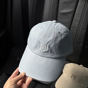 Macro detail of high-quality cotton baseball cap with white FD letter embroidery