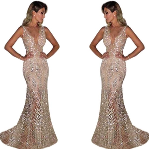 Detail of champagne gold sequin embroidery on a deep V-neck mermaid evening gown