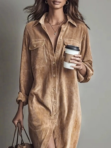 Detail of camel corduroy maxi dress featuring a lapel collar and twin chest pockets