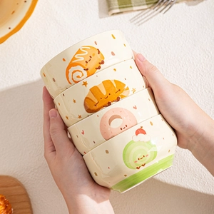 Set of four stackable ceramic bowls with cute cartoon bread patterns for kitchen dining